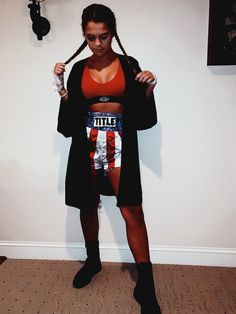 a woman is posing for the camera with her hair in pigtails and an american flag skirt