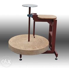 a small table with a glass top on wheels