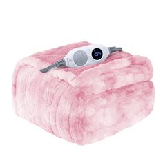 a pink blanket with an electric hair dryer on top