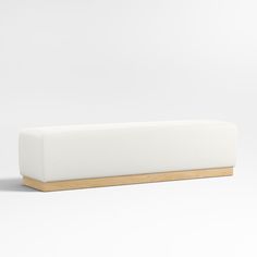 a white bench with wooden legs on a white background