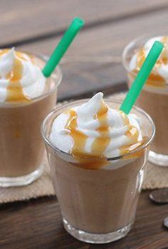 three cups filled with hot chocolate and whipped cream