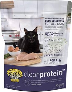 a black cat sitting on top of a counter next to a bag of clean protein