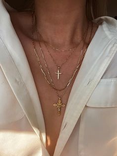 DESCRIPTIONTake us to church. A cross pendant lined with diamond cuts placed on our Singapore Chain makes the perfect everyday necklace. Layer with The Crucifix Necklace for effect. DETAILS- always made in 14k gold- pendant measurement: 22mm x 12mm- model wears a 18" Gold Crucifix Necklace, Layered Cross Necklace, Cross Jewelry Necklace, Crucifix Necklace, Christian Necklace, Stacked Necklaces, Gold Cross Necklace, Gold Cross Pendant, Expensive Jewelry