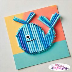 a card made to look like a fish with blue strips on it's face