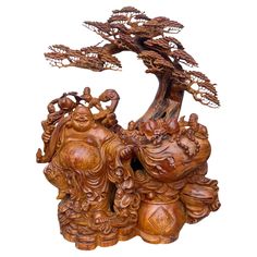 an intricately carved wooden tree with buddhas