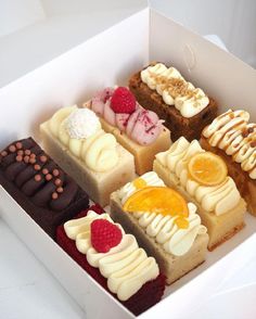 a box filled with different types of desserts