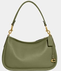 From COACH, the Cary Pebble Leather Crossbody Shoulder Bag features:Soft pebble leatherZip-top closureFabric liningInside snap pocketDetachable handleDetachable strap for shoulder or crossbody wearApprox. 11" L x 7.25" H x 4.25" W bag; 7.5" handle drop; 21.5" handle dropImported. Cute Bags, Dillard's