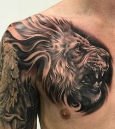 a man with a lion tattoo on his chest