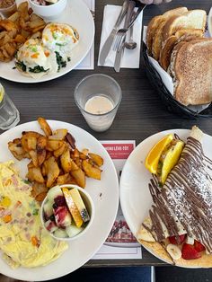 plates of food on a table with silverware and utensils