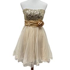 Studio Y Gold Sequined Strapless Dress! Champagne Tulle W/Glitter. Size 7/8. New With Tags From Maurices. Never Worn. Strapless. Very Sparkly And Shimmery. Lined. Sequin Metallic Goodness! Flowy Fit And Flare Style Dress. Two Layers Of Tulle, And The Top One Has Glitter. Gold Sequin Bodice. Elastic Along The Top So It Can Fit A Variety Of Sizes Comforta. Attached Satin Belt / Sash. Materials: Shell 100% Polyester. Contrast 100% Nylon Lining 55% Polyester, 45% Lining Please Review Pictures To See Satin Belt, Dress Champagne, Glitter Gold, Gold Sequin, Gold Dress, Rose Color, Style Dress, Gold Glitter, Fit And Flare