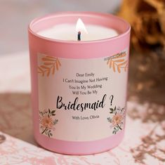 a candle that is sitting on a table with a card in front of it saying, i can't imagine not having you in my wedding will you be my bridesmaid