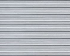 a close up view of the side of a building with metal slats on it