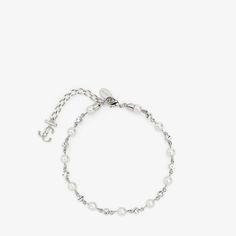 The JC Anklet combines elegance with modernity. Italian-crafted in silver-finish metal, the bracelet showcases some of Jimmy Choo's classic symbols - the pearl and JC monogram - as well as sparkling crystals. Pair with the coordinating JC Star Bracelet for easy glamour. Crystal Anklet, Pearl Anklet, Pearl Crystal, Star Bracelet, Timeless Accessories, White Crystal, Metal Bracelets, Women Accessories Jewelry, Bracelet Designs