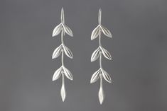 Silver Earrings - Cascading double-leaf links with single leaf drop, forming lovely dangles that are easy to wear.<br><br>2.88l, 0.5w. Sterling silver ear wires. Simple Silver Earrings Dangle, Silver Leaf Jewelry, Leaf Drop Earrings, Silver Leaf Minimalist Earrings, Silver Leaf-shaped Nature-inspired Jewelry, Elegant Leaf-shaped Sterling Silver Earrings, Silver Leaf-shaped Metal Earrings, Sterling Silver Leaf-shaped Earrings, Leaf Necklace Silver