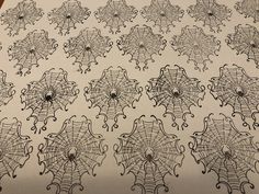 an image of spider webs drawn on paper