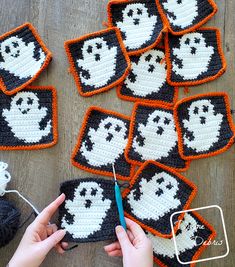 crocheted ghost coasters are being worked on by someone using scissors and yarn