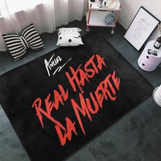 a black rug with the words real hash da murri written on it in red