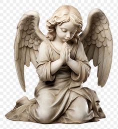 an angel statue sitting on the ground with his hands clasped to his chest and praying