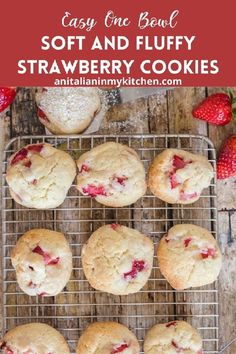 strawberry cookies cooling on a wire rack with strawberries in the background