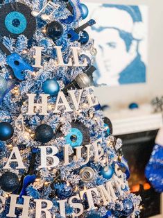 a christmas tree decorated with blue and silver ornaments