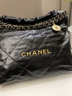 Chanel 22 MediumBlack Calfskin AGHWSize 35 x 33 x 8 cmStrap drop 20 cmMicrochipJuly 20239.8/10 Like New (tried once, minimal storage signs of any otherwise like new)Includes full set box, dust bag and receiptRTP 8710 sgdPrice now 7500 sgd  5600 usd CN5526-01 Chanel 22 Handbag, Chanel 22 Bag, Chanel Number 5, Chanel 22, Minimal Storage, Dream Bag, Handbag Essentials, Gold Ounce