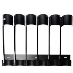 four black lamps are lined up in a row