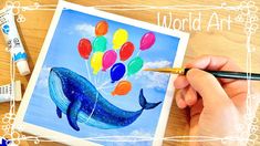 someone is painting a blue whale with balloons on it's back and the words world art day written below