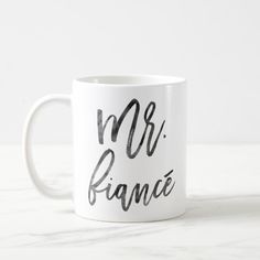 a white coffee mug with the words mr and mrs france printed on it's side