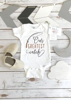 a baby bodysuit with the words, i want to choose between loving and adopted