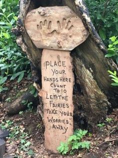 a carved tree stump with writing on it