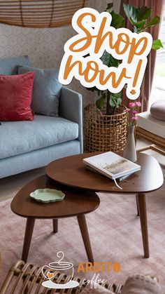 a living room filled with furniture and a sign that says shop now on the table