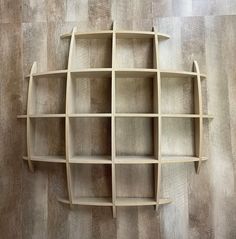 a wooden shelf with several shelves on it