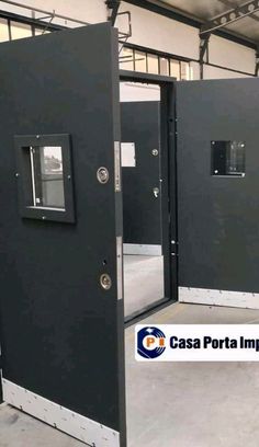 the inside of a building with two doors and one door opened to reveal another room