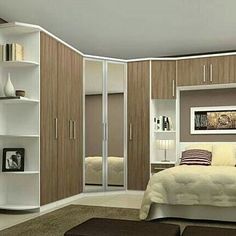 a bed sitting in a bedroom next to a white closet