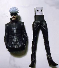 an action figure is posed next to a flash drive