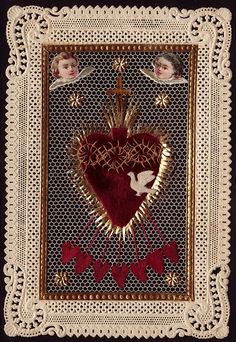 an embroidered heart with angels on it and two cherubs in the center, surrounded by crocheted lace