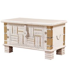 a white and gold chest with drawers