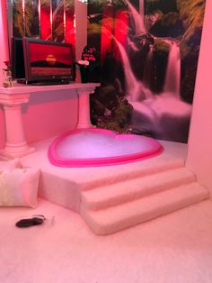 there is a pink bathtub in the middle of some steps and a tv on top of it