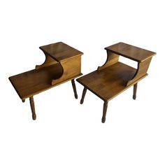 two wooden end tables with curved legs on each side, one is turned upside down