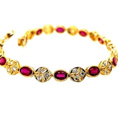 A Magnificent 5.46 carat 18k Yellow Gold Natural Ruby and Diamond Bracelet.  The piece is set with 13 oval natural rubies weighing 4.55 carats, along with 39 natural rounds weighing 0.91 carats.  The length is just over 6.75" inches, and weighs 11.6 grams. Luxury Red Round Gold Bracelet, Red Oval Diamond Classic Bracelet, Classic Red Oval Diamond Bracelet, Red Oval Classic Diamond Bracelet, Red Oval Diamond Gemstone Bracelet, Red Oval Fine Jewelry Tennis Bracelet, Red Oval Tennis Bracelet Fine Jewelry, Luxury Red Oval Bracelet, Red Diamond Oval Tennis Bracelet