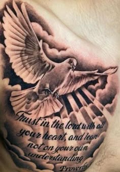 a chest tattoo with a dove on it and an inscription in the middle that reads trust in the lord with all your heart and tears