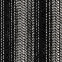 a black and white striped fabric textured with some small stripes in the center, as if it were woven or wovened together