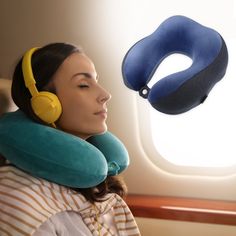 a woman with headphones on looking at an inflatable pillow that is attached to her neck