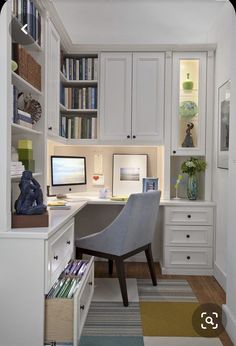 a home office with built in bookshelves and desk