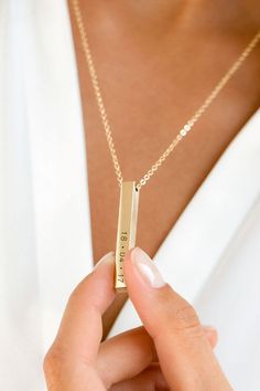 This stylish necklace with it's free moving square bar pendant can be personalized to create a treasured and special gift for a loved one. The bar can be engraved with your special message, a name, or date which the recipient can choose to wear with the message showing or turn the slider to keep it secret. #necklace #personalizednecklace #customnecklace #goldnecklace #silvernecklace #womensnecklace #barnecklace Affordable Customized Stainless Steel Necklaces, Luxury Elegant Bar Necklace, Luxury Gold Bar Necklace For Everyday, Elegant Rectangular Bar Necklace For Personalized Gift, Minimalist Rectangular Name Necklace For Gifts, Minimalist Rectangular Name Necklace As Gift, Minimalist Engraved Rectangular Bar Necklace, Minimalist Custom Name Rectangular Jewelry, Minimalist Personalized Name Necklace With Rectangular Pendant