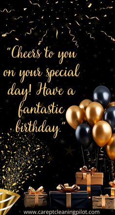 a birthday card with gold and black balloons, presents and confetti on the table