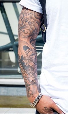 a man with a tattoo on his arm