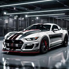 a white and black mustang car in a parking garage with red stripes on the hood