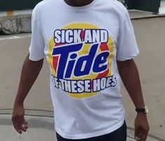 a man wearing a sick and tide t - shirt