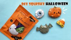 paper mache halloween decorations on a blue background with the words diy squisty halloween